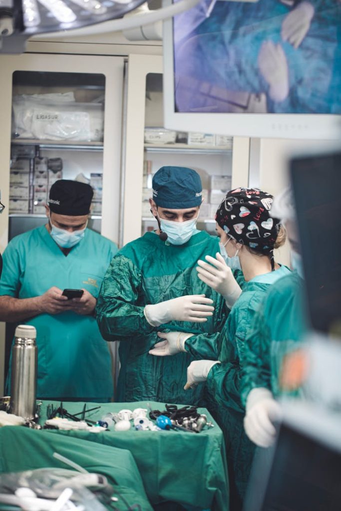 Medical team wearing masks performing surgery in a hospital operating room, Baku.